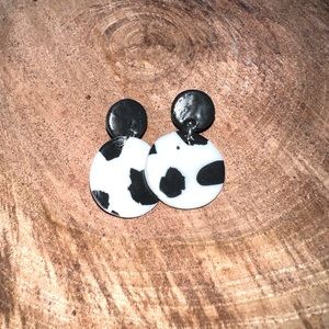 Cow print clay earrings.